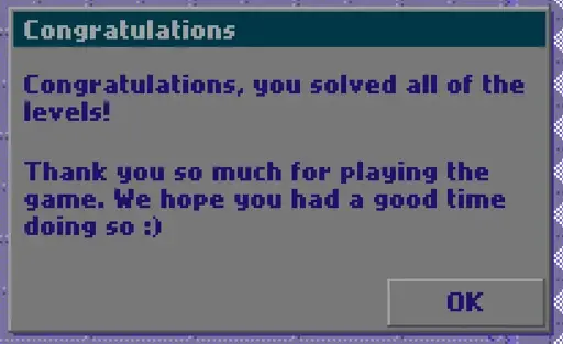 puzzle game end message screenshot saying "Congratulations, you solved all of the levels! Thank you so much for playing the game. We hope you had a good time doing so :)"