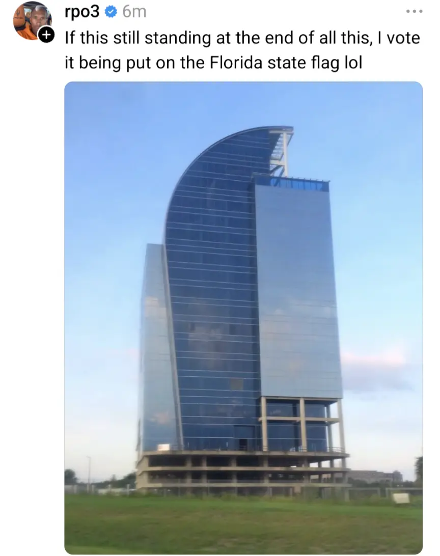 Photo of the 'i4-eyesore' building with the text from a social media app "If this is still standing at the end of all this [hurricane] it deserves to be on the Florida flag"