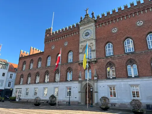 The Danish flag and the Ukrainian flag, side by side at the town hall in Odense